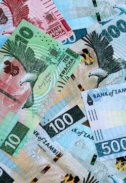 Zambian kwacha money banknotes pile on table. Zambia bills of ZMW currency close up