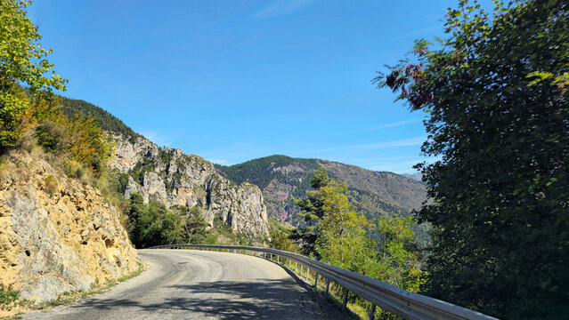 Winding mountain road M30 on Route des Grandes Alpes near Roubion village, France, Europe.
