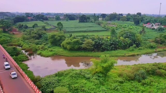 Aerial Drone View of Rural Road and Green Landscape with River in Countryside