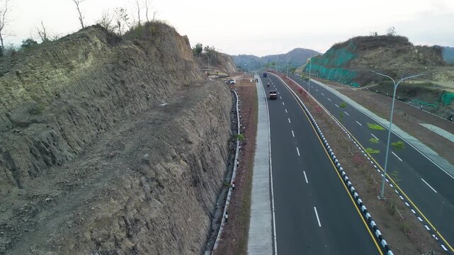 Stunning aerial view of Jl Bypass BIL Mandalika road during sunset in Lombok