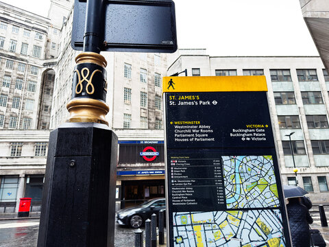 St. James's Park wayfinding map and pedestrian sign by the Underground in London, UK on a rainy day