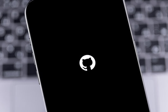 GitHub logo icon mobile app on a screen smartphone iPhone. GitHub is the largest web service for hosting and developing IT projects. Batumi, Georgia - March 25, 2026