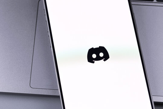 Discord logo mobile app on a screen smartphone iPhone. Discord is a cross-platform proprietary instant messaging system with support for VoIP, video conferencing. Batumi, Georgia - March 23, 2026