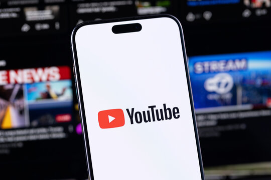 YouTube logo mobile app on a screen smartphone iPhone. YouTube is a free video sharing application that anyone can watch. Batumi, Georgia - March 19, 2026