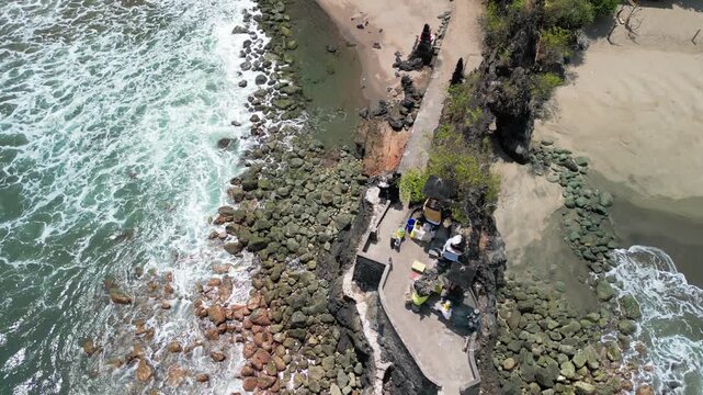 Batu Bolong Temple in Bali Indonesia with ocean cliffs