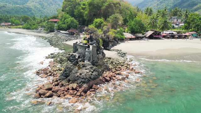 Batu Bolong Temple in Bali Indonesia with ocean cliffs