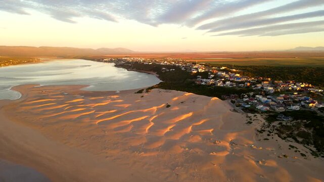 Abstract dune landscape of Witsand near Breede river mouth at first light. Drone