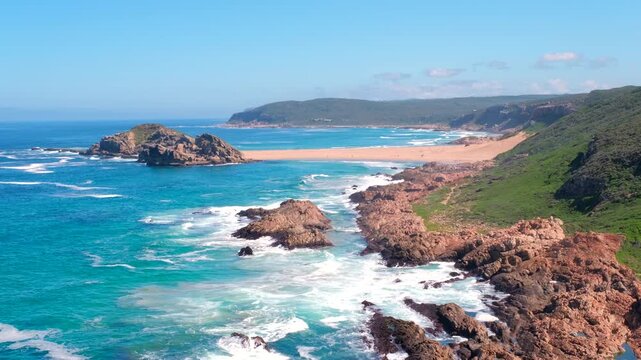 Picturesque coastal landscape of Robberg Nature Reserve with top view over The Island and sandy tombolo in Plettenberg Bay