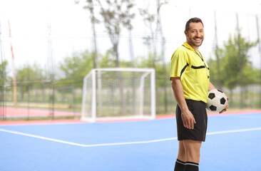 Obraz premium Football referee holding a ball