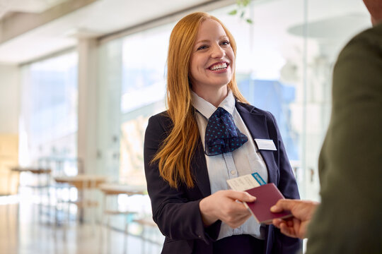 Showing flight ticket and passport at flight attendant