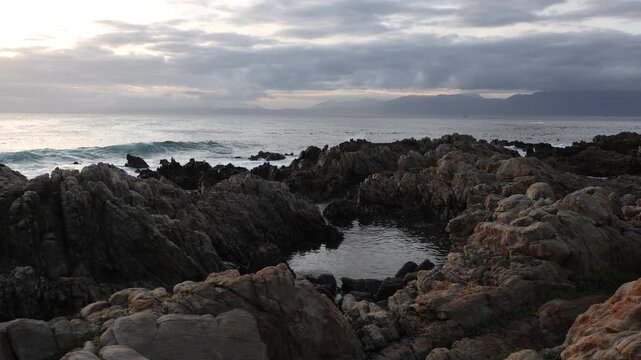 rocky coastline of DeKelders, Gansbaai, South Africa at sunset