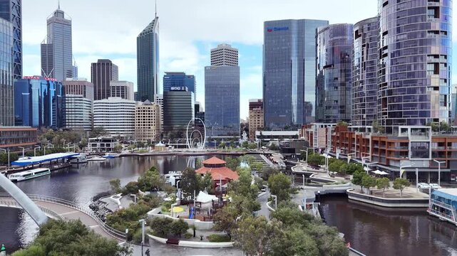 Elizabeth Quay pedestrian bridge in Perth glowing at sunset with vibrant evening city lights