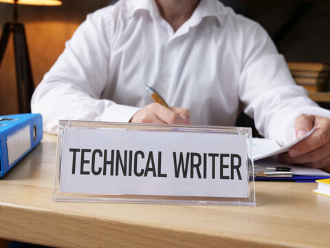 Technical Writer working on documentation in modern office, creating user manuals, software guides and digital content for technology products