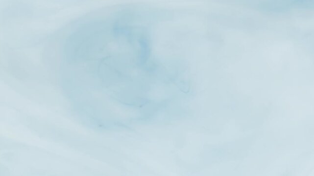 Abstract pastel light blue ink slowly swirling and dissolving in water, creating a mesmerizing watercolor cloud effect. Calm and relaxing ethereal fluid art motion