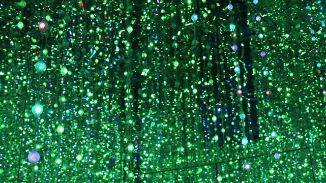 Mesmerizing infinite mirror room filled with hanging LED crystal lights changing