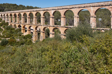 Obraz premium Historical roman aqueduct in Tarragona, Devilsl point. Catalonia. Spain