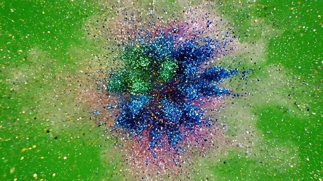 Vibrant explosion of colorful powder paint creating abstract patterns against a bright green background