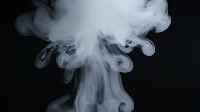 Abstract white smoke rising and forming creative shapes against a dark black background, slow motion