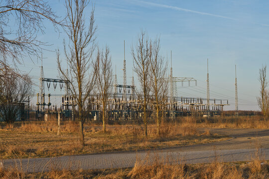 Electrical Substation with High Voltage Towers in an Autumn Landscape View
