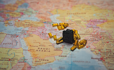 Naklejka premium Fuel canister with gold bars on Iran map resource wealth concept.