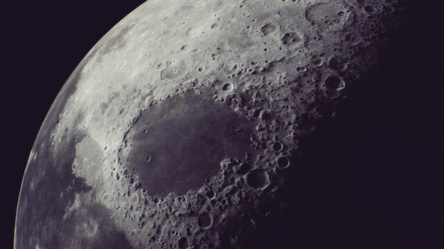 A breathtaking view showcases the moons rugged terrain with craters illuminated by soft light. The shadows create a dramatic landscape that enchants stargazers on a clear night.