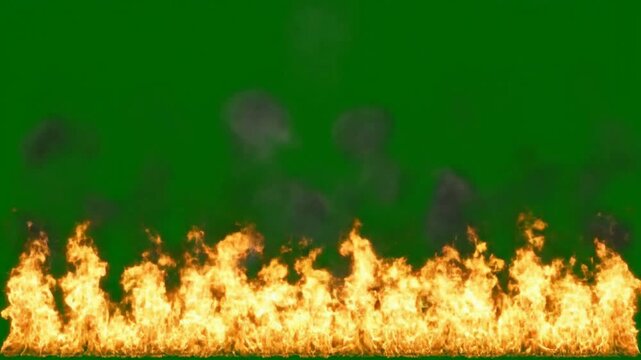 Realistic fire wall with rising smoke isolated on green screen for vfx compositing flames wall of fire