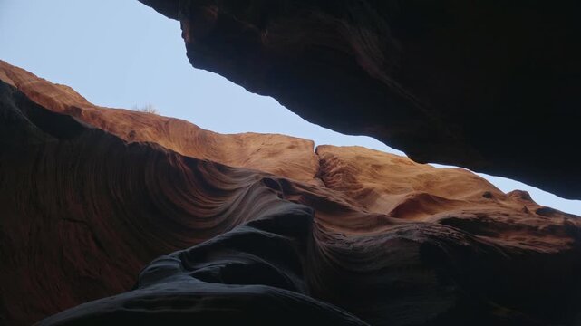 Narrow Buckskin Gulch slot canyon and towering sandstone walls, sliver of sky above, abstract rotation