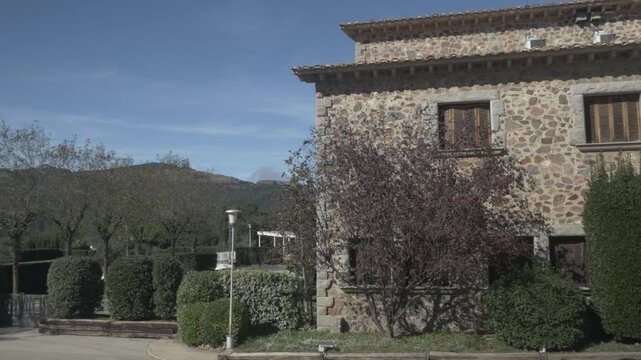 Building Sant Llorenc mountain sky clouds jib crane Polecam pan right