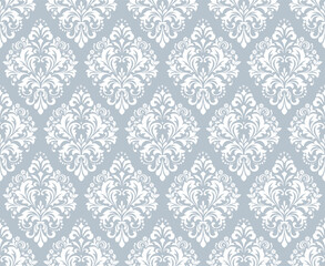 Fototapeta premium Wallpaper in the style of Baroque. White and gray floral ornament. Seamless vector background. Graphic pattern for fabric, wallpaper, packaging. Ornate Damask flower illustration