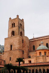 Fototapeta premium Monreale cathedral and Benedictine Cloister in Monreale, near Palermo, Sicily. Architectural detail of the cloister of the Monreale cathedral, showing arches, columns and the garden. 