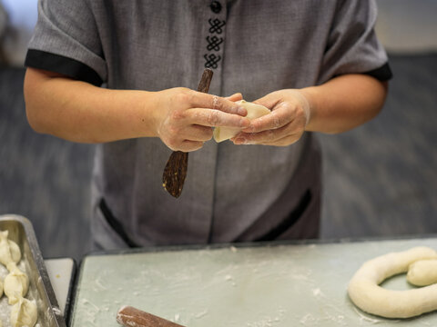 Chef Focuses on Wrapping Dumplings Close Up