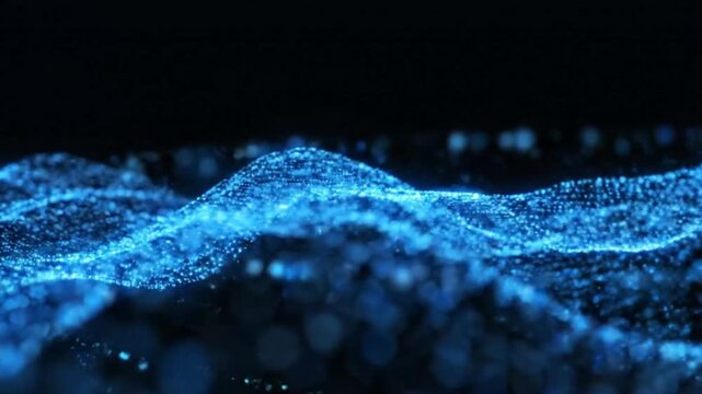 Glowing blue particles form wave-like patterns against a dark background