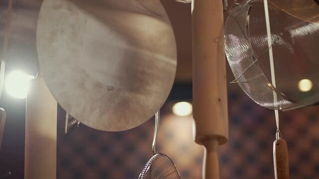 Kitchen candles in a pizzeria hung decoratively from the ceiling
