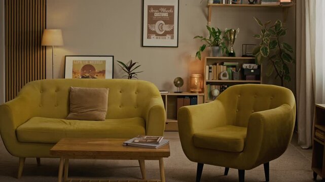 Medium shot of spacious living room fully equipped with comfortable and cozy furniture and decorated with poster, pictures and houseplants