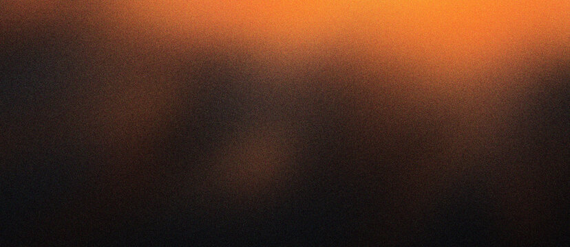 Cinematic dark orange gradient background with grainy texture. Moody amber light on black backdrop for luxury branding. Abstract warm glow wallpaper for dramatic web design and social media.