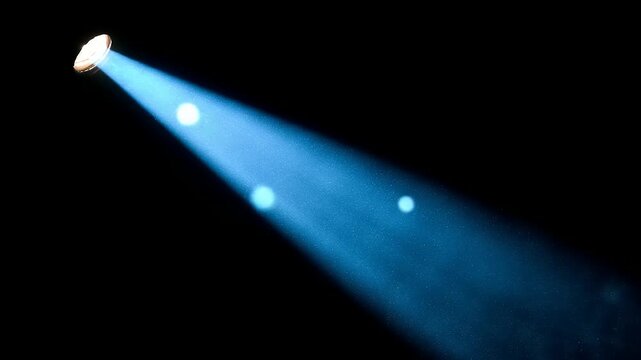 Bright blue spotlight beam against black background conceptual design