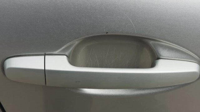 Weathered vehicle handle. Authentic city car handle showing scuff marks and grime from everyday use