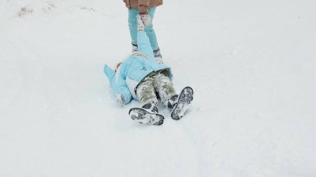 Children wallowing In winter forest.