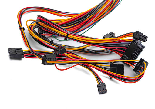 Colorful computer power supply cables with various black connectors isolated on a white background.