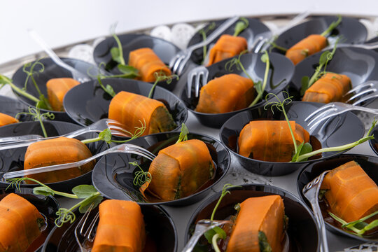 Gourmet Smoked Salmon Rolls in Black Mini Bowls with Microgreens, Elegant Catering Appetizers for Luxury Event