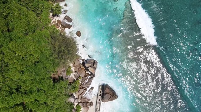 Aerial view of beautiful island at Seychelles in the Indian Ocean, Praslin Island. Top view from drone. Slow motion