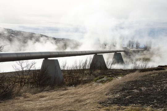 Geothermal area, steamy, hot springs with pipeline, hot water transport, Deildartunguhver, Reykholtsdalur, Iceland