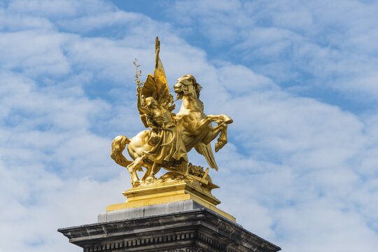 Golden equestrian statue on the Pont Alexandre, Paris, France