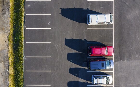Drone shot, parking lot, parked cars side by side from above, Norway