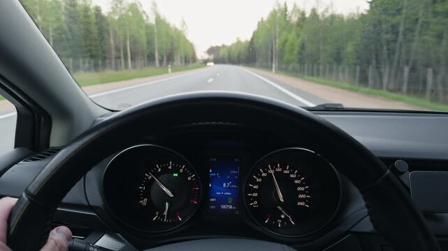 Open road vista. Cinematic shot illustrating drive along sparsely populated sunlit highway