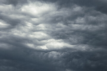 Obraz premium Dramatic sky background. Dark gray clouds forming a storm.