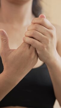 Closeup woman holds his wrist. hand injury, feeling pain. Health care and medical concept. and those with a family history of degenerative knuckles.	