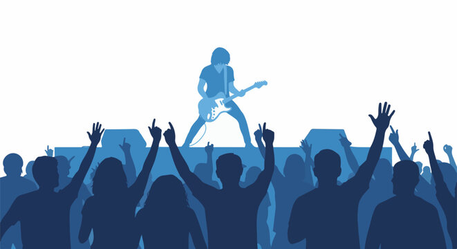 Silhouette crowd cheers for guitarist on stage at a concert