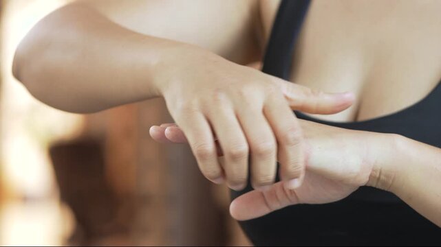 Closeup woman holds his wrist. hand injury, feeling pain. Health care and medical concept. and those with a family history of degenerative knuckles.	