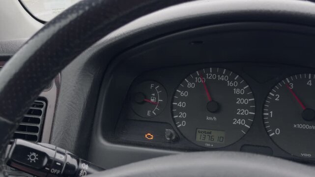 Car instrument panel close view. Detailed image of car dashboard highlighting meters and indicators